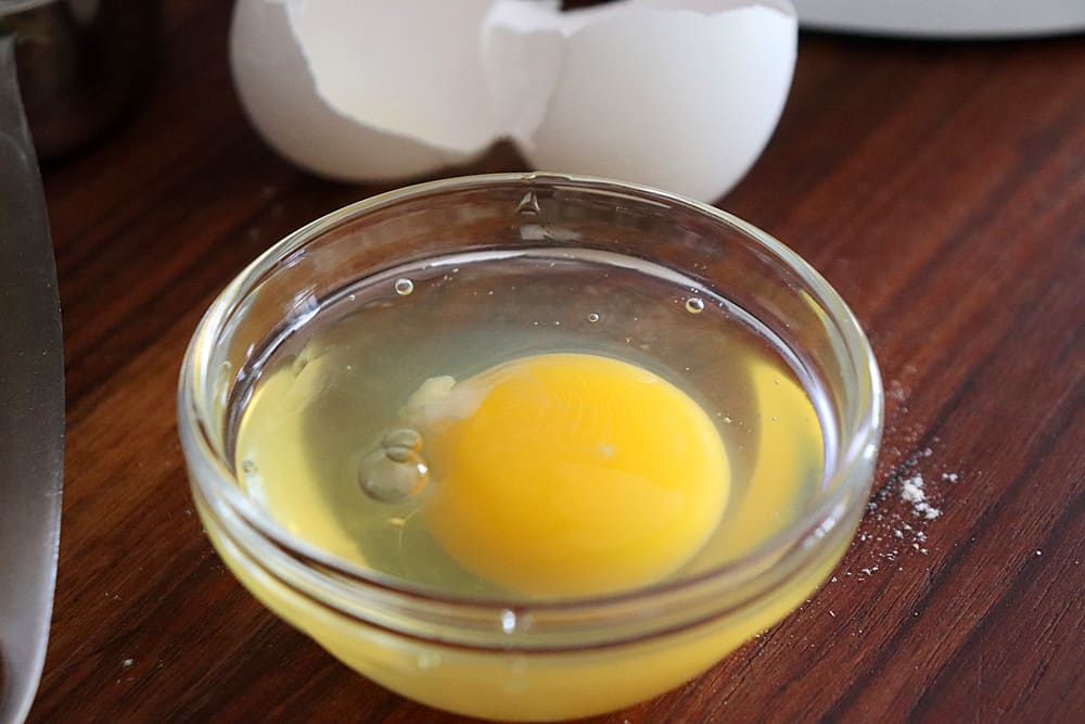 An egg in a small glass prep bowl